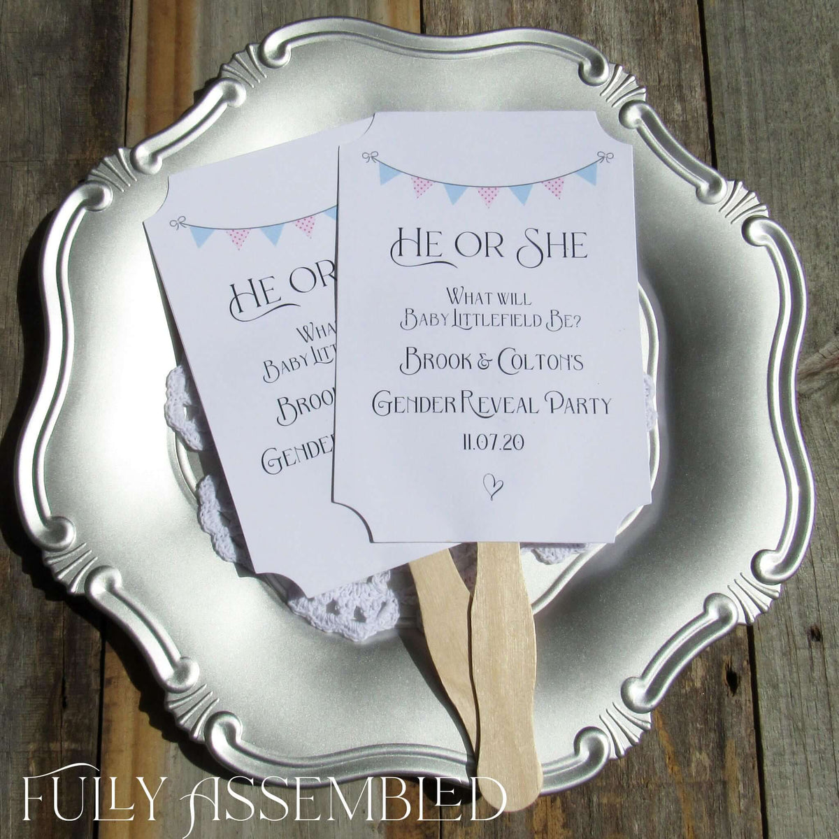Gender Reveal Party Fans printed on white cardstock, two sided with wooden handle hidden between, printing on one side only.  They arrive to you fully assembled and ready for your event.