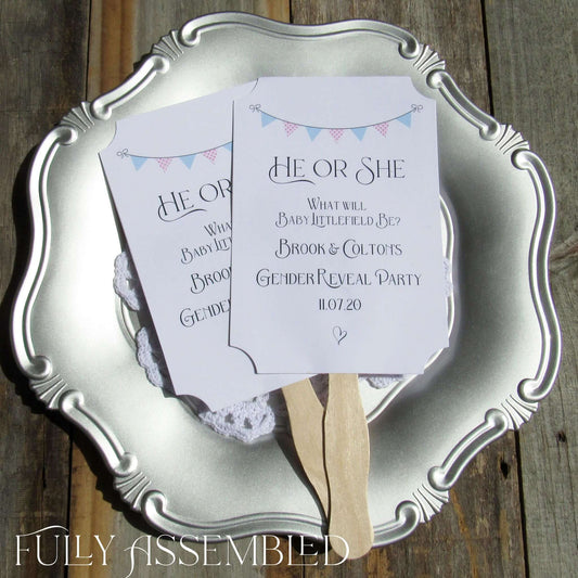 Gender Reveal Party Fans printed on white cardstock, two sided with wooden handle hidden between, printing on one side only.  They arrive to you fully assembled and ready for your event.