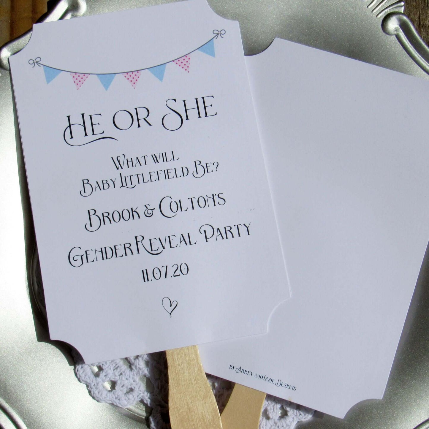 Gender Reveal Party Fans printed on white cardstock, two sided with wooden handle hidden between, printing on one side only.  They arrive to you fully assembled and ready for your event.