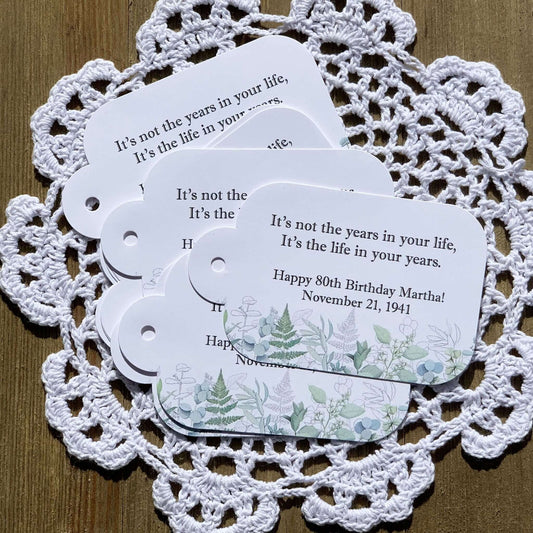 Adult Birthday Favor Tags personalized for the guest of honor. Adorned with greenery for a soft touch.