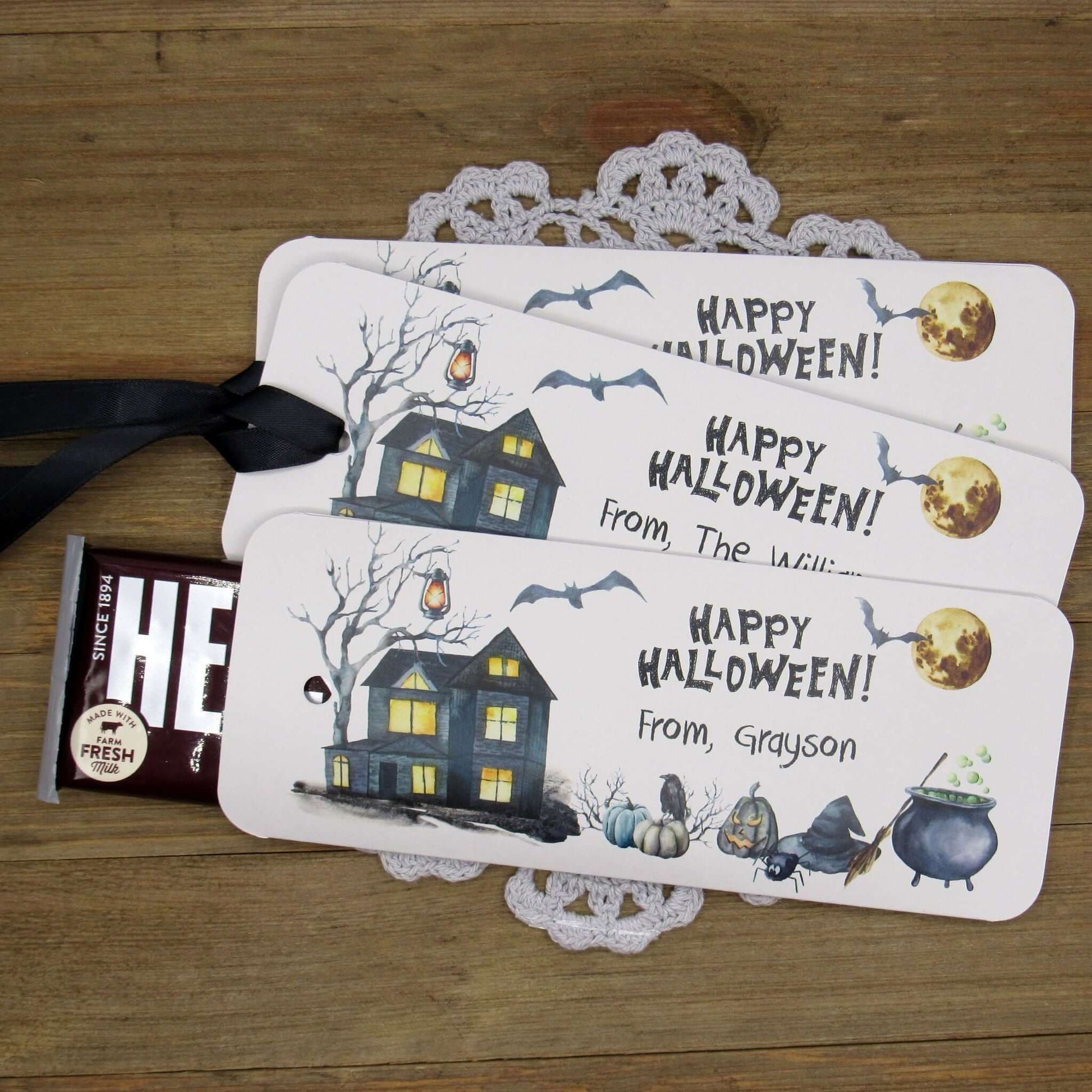 Spooky Personalized Halloween Candy Bar Favors, slide a candy bar in the open end, attach the ribbon for a sweet Halloween treat.  Printed on gray card stock these are very sturdy.  