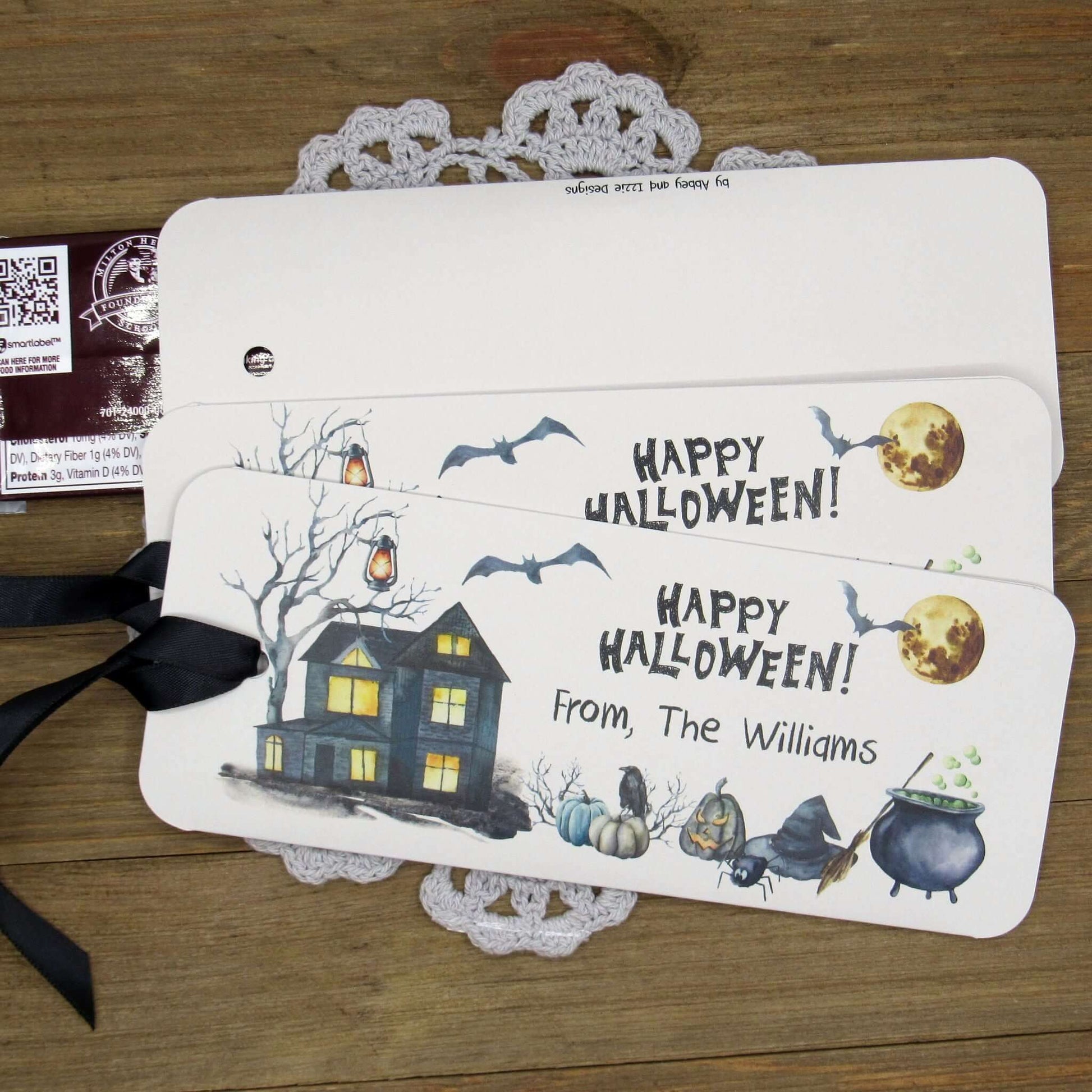 Spooky Personalized Halloween Candy Bar Favors, slide a candy bar in the open end, attach the ribbon for a sweet Halloween treat.  Printed on gray card stock these are very sturdy.  