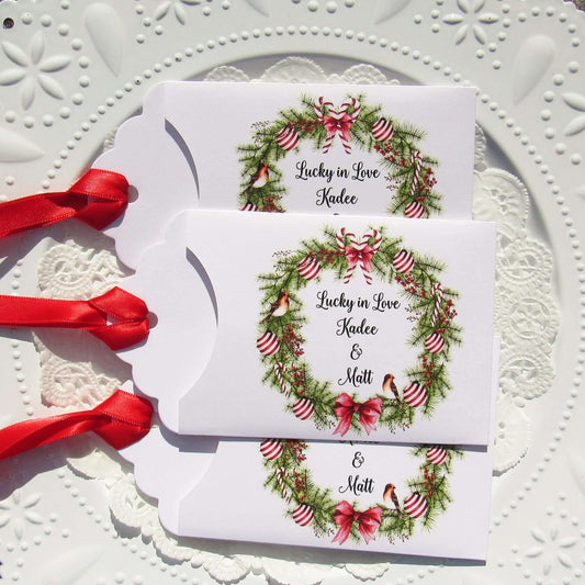 Fun Winter Wedding Reception Favors printed on white card stock with a holiday wreath these are personalized for the bride and groom.  Adorned with a ribbon which comes attached.  Our wedding lottery favors are sure to be a hit.