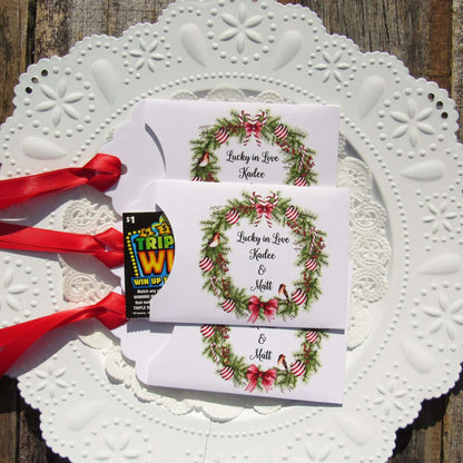 Fun Winter Wedding Reception Favors printed on white card stock with a holiday wreath these are personalized for the bride and groom.  Adorned with a ribbon which comes attached.  Our wedding lottery favors are sure to be a hit.
