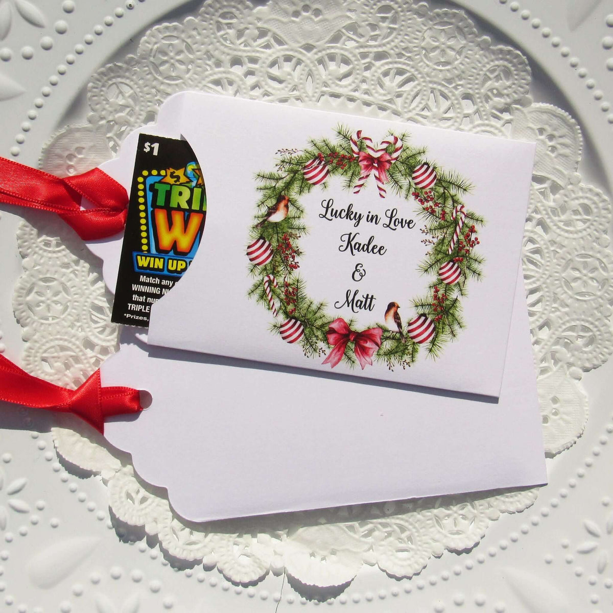 Fun Winter Wedding Reception Favors printed on white card stock with a holiday wreath these are personalized for the bride and groom.  Adorned with a ribbon which comes attached.  Our wedding lottery favors are sure to be a hit.