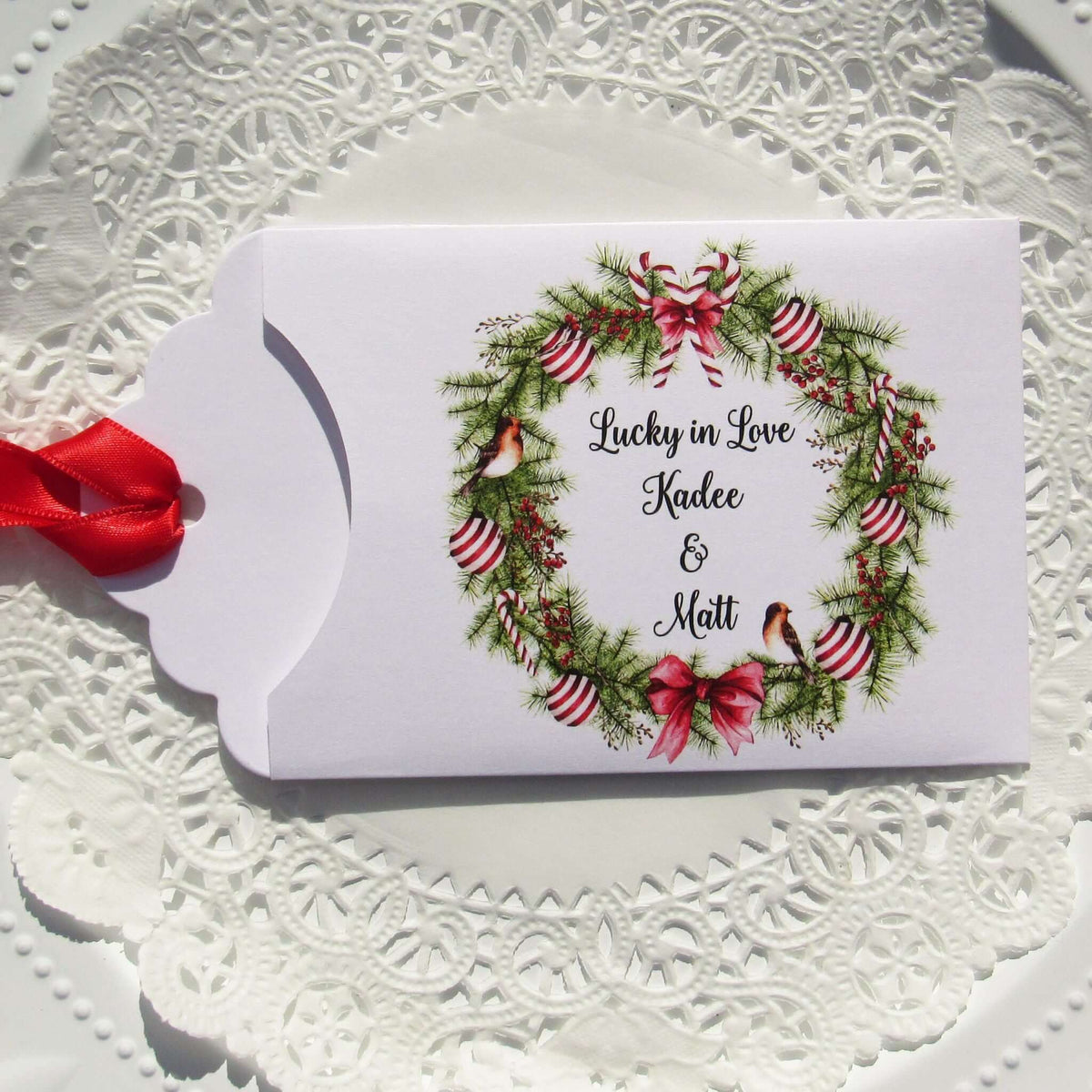 Fun Winter Wedding Reception Favors printed on white card stock with a holiday wreath these are personalized for the bride and groom.  Adorned with a ribbon which comes attached.  Our wedding lottery favors are sure to be a hit.