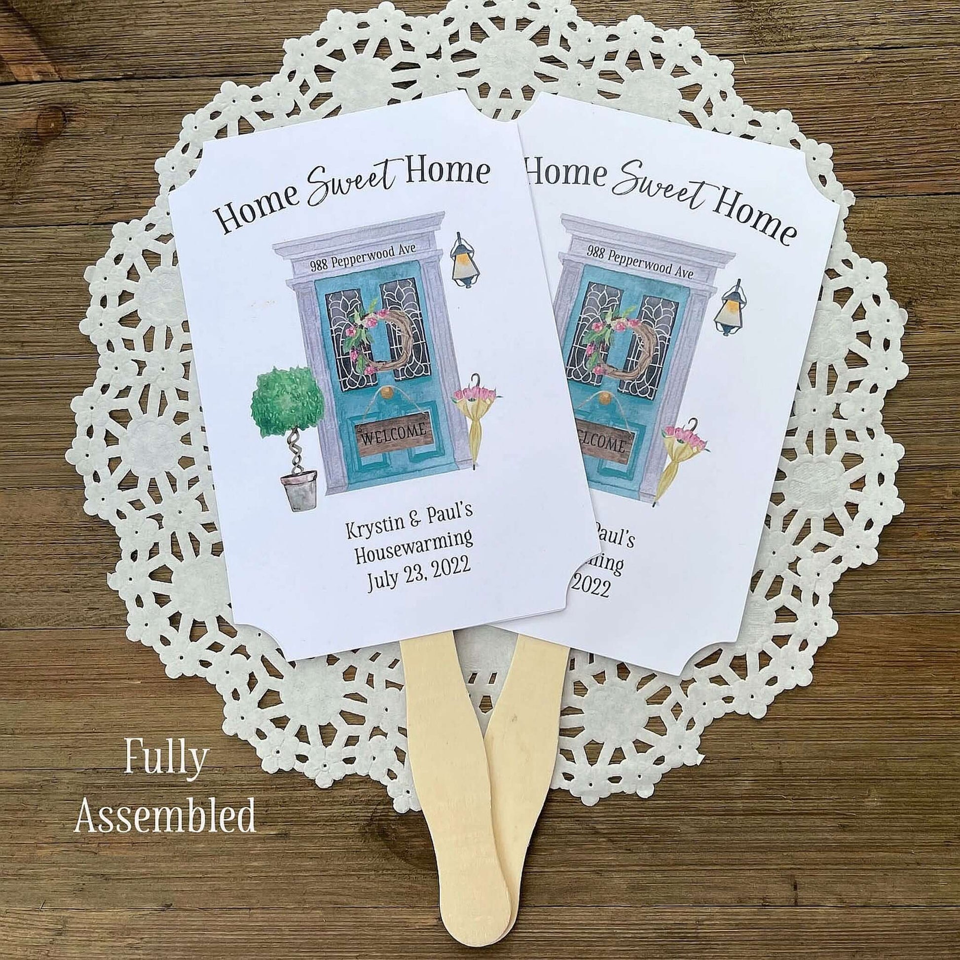 Our personalized housewarming favor fans are perfect for that summer party.  Printed on white cardstock and adorned with a beautiful front door these are sure to be a hit.  A great keepsake for guests to take home.