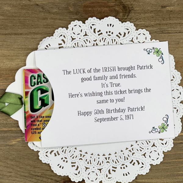 Irish Birthday Party Favors printed with 'the luck of the Irish' and the honoree name and birth date.  Lottery ticket envelopes printed on white card stock adorned with a green ribbon and shamrocks.  