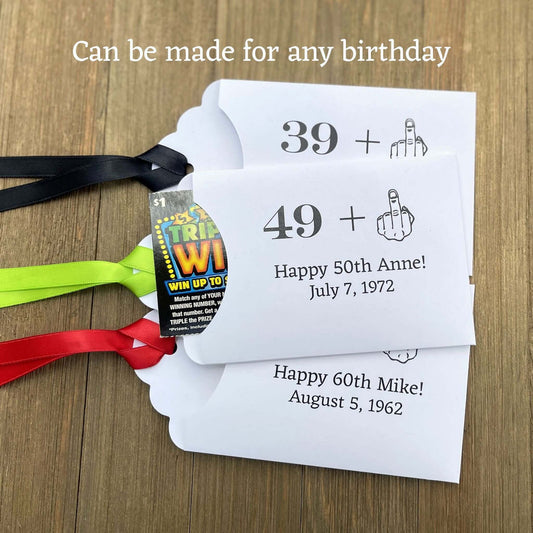  Funny Adult Birthday Favors with your age plus one shown as the middle finger!  Personalized for the guest of honor, printed on white card stock with your choice of ribbon color.  Slide a lottery ticket in to see who goes home with the cash.