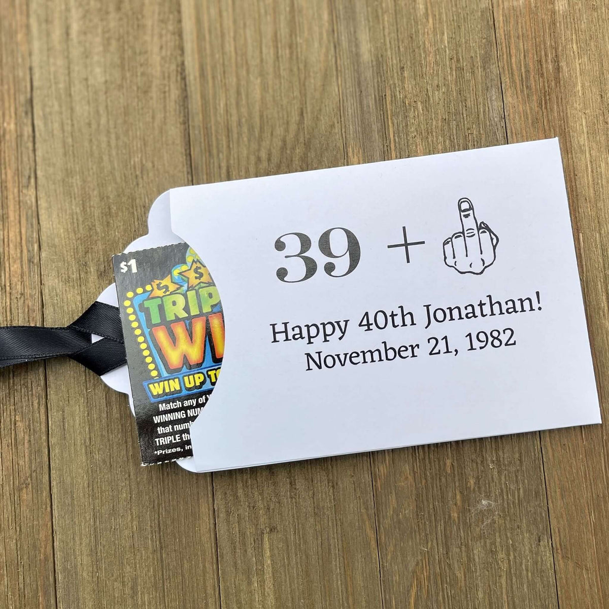 Funny Adult Birthday Favors with your age plus one shown as the middle finger!  Personalized for the guest of honor, printed on white card stock with your choice of ribbon color.  Slide a lottery ticket in to see who goes home with the cash.