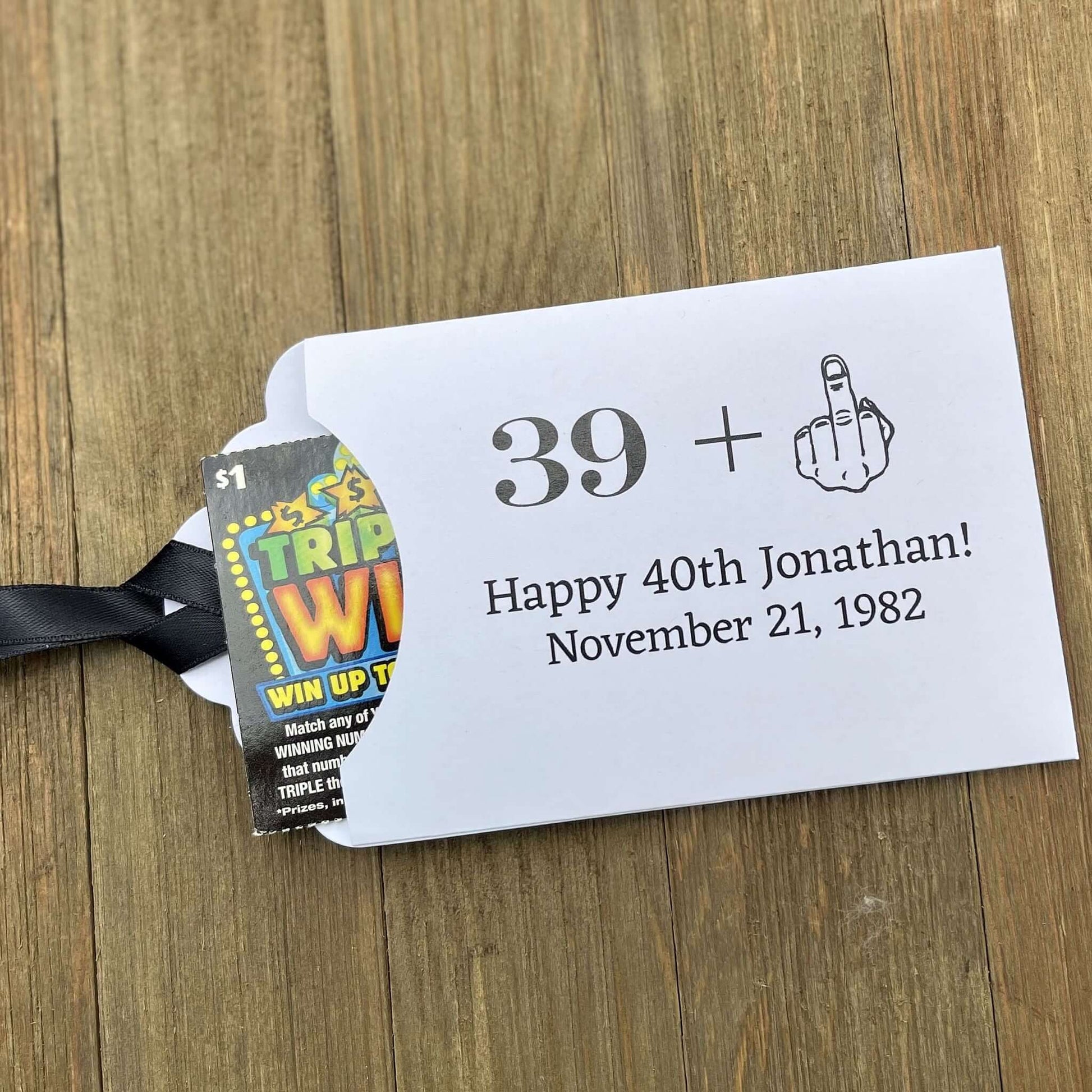 Funny Adult Birthday Favors with your age plus one shown as the middle finger!  Personalized for the guest of honor, printed on white card stock with your choice of ribbon color.  Slide a lottery ticket in to see who goes home with the cash.