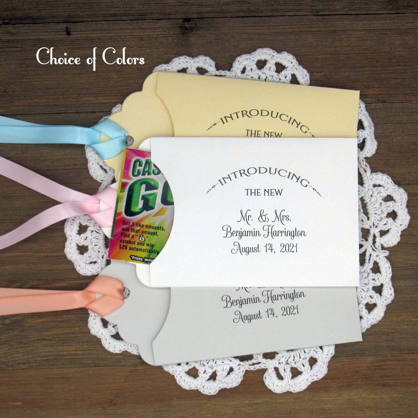 Lottery Ticket Wedding Guest Favors personalized for the bride and groom.  Printed with 'introducing the new Mr. & Mrs. followed by your personal information.  Slide a lottery ticket in these for a fun favor.  Your choice of envelope and ribbon color.