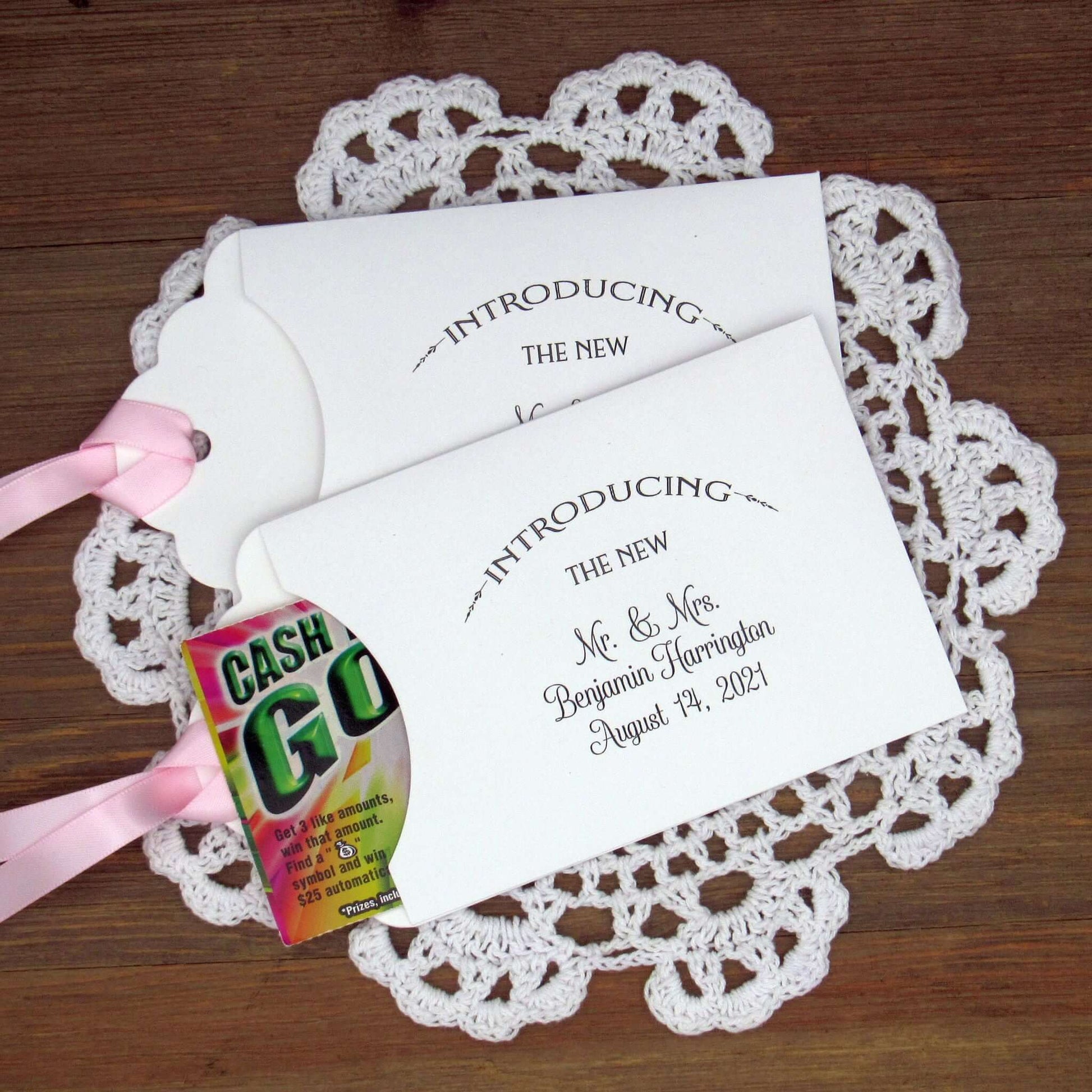 Lottery Ticket Wedding Guest Favors personalized for the bride and groom.  Printed with 'introducing the new Mr. & Mrs. followed by your personal information.  Slide a lottery ticket in these for a fun favor.  Your choice of envelope and ribbon color.