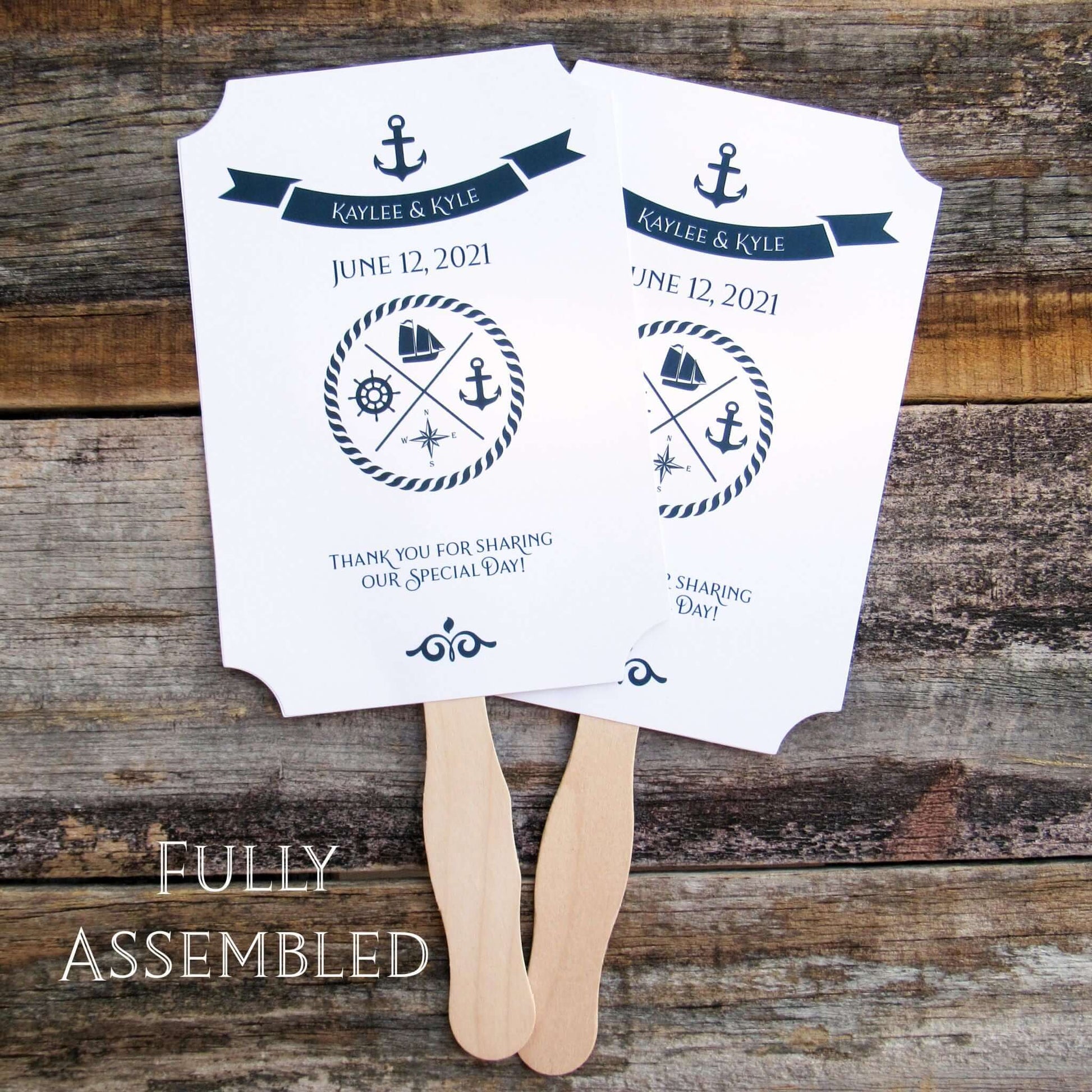 Personalized Nautical Theme Wedding Fans  printed on white card stock with navy text.  Hand fans are personalized for the bride and groom, fans ship assembled and ready to use.  Two sided with handle hidden between for a more finished look.  