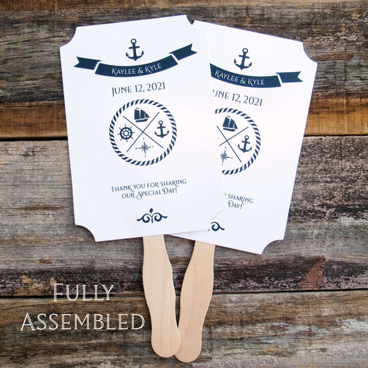 Personalized Nautical Theme Wedding Fans  printed on white card stock with navy text.  Hand fans are personalized for the bride and groom, fans ship assembled and ready to use.  Two sided with handle hidden between for a more finished look.  