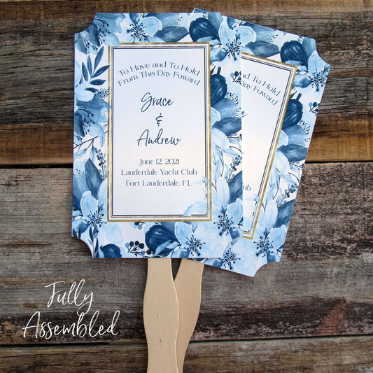 Navy Blue Personalized Wedding Fans, floral navy frame surrounds the personalization.  To have and to hold from this day forward with bride and grooms names, wedding date, place, city and state.  Fans are two sided with handle hidden, printing on one side only.  Shipped to you fully assembled.