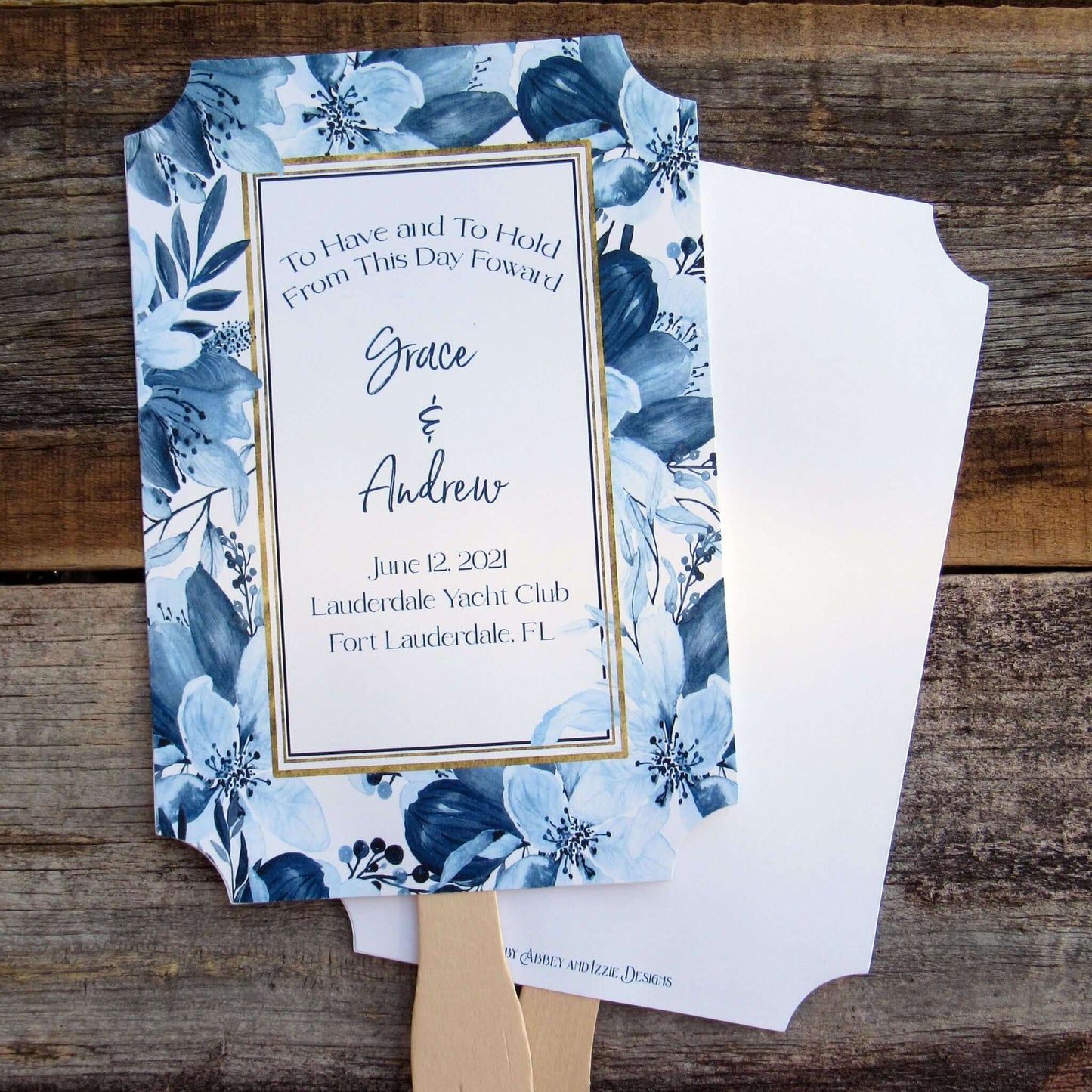 Navy Blue Personalized Wedding Fans, floral navy frame surrounds the personalization.  To have and to hold from this day forward with bride and grooms names, wedding date, place, city and state.  Fans are two sided with handle hidden, printing on one side only.  Shipped to you fully assembled.