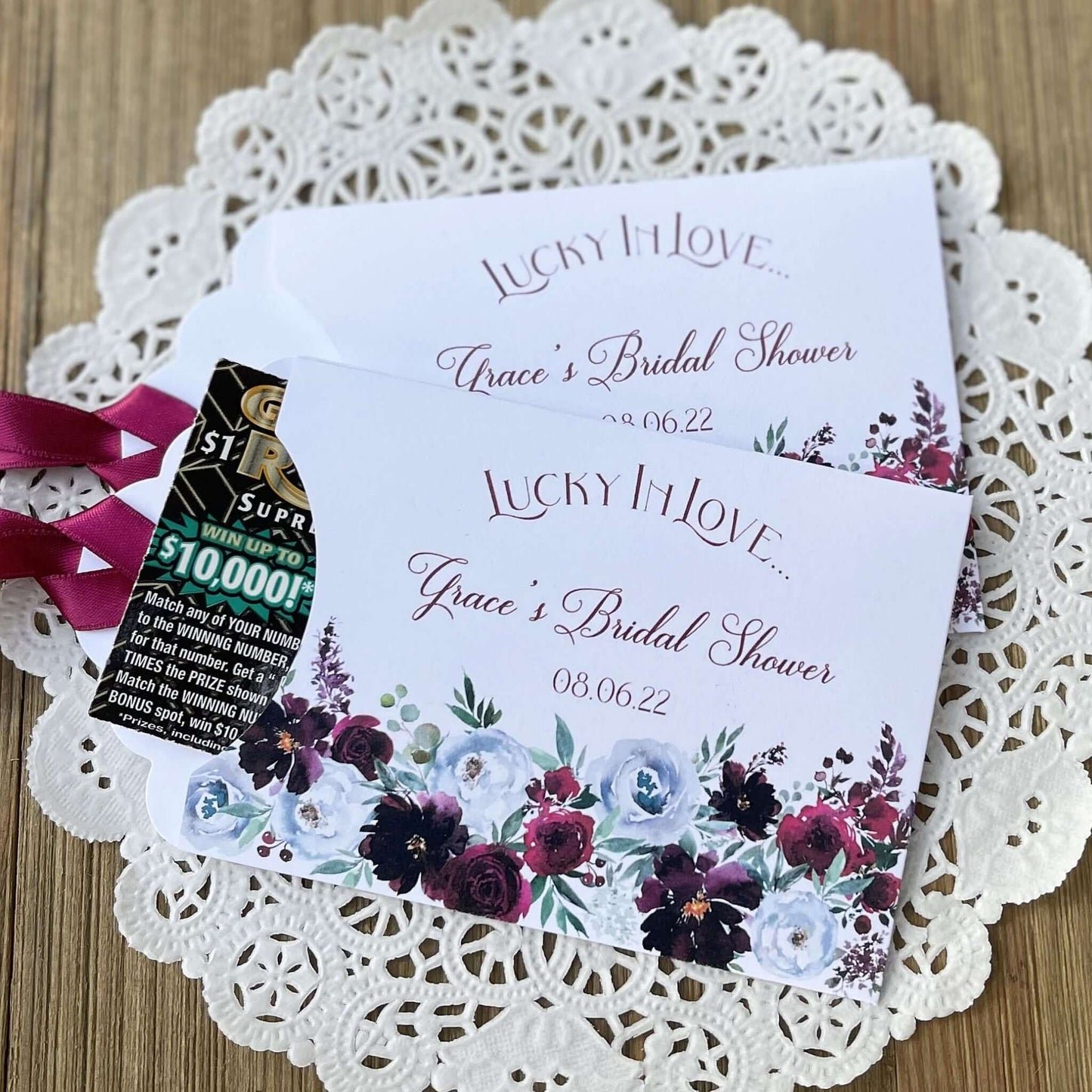 Lucky in love bridal shower favors, Burgundy Bridal Shower Favors Personalized  white envelopes adorned with burgundy flowers and personalized for the bride to be.  Burgundy ribbon comes attached, slide a lotto ticket in for a fun bridal shower favor.