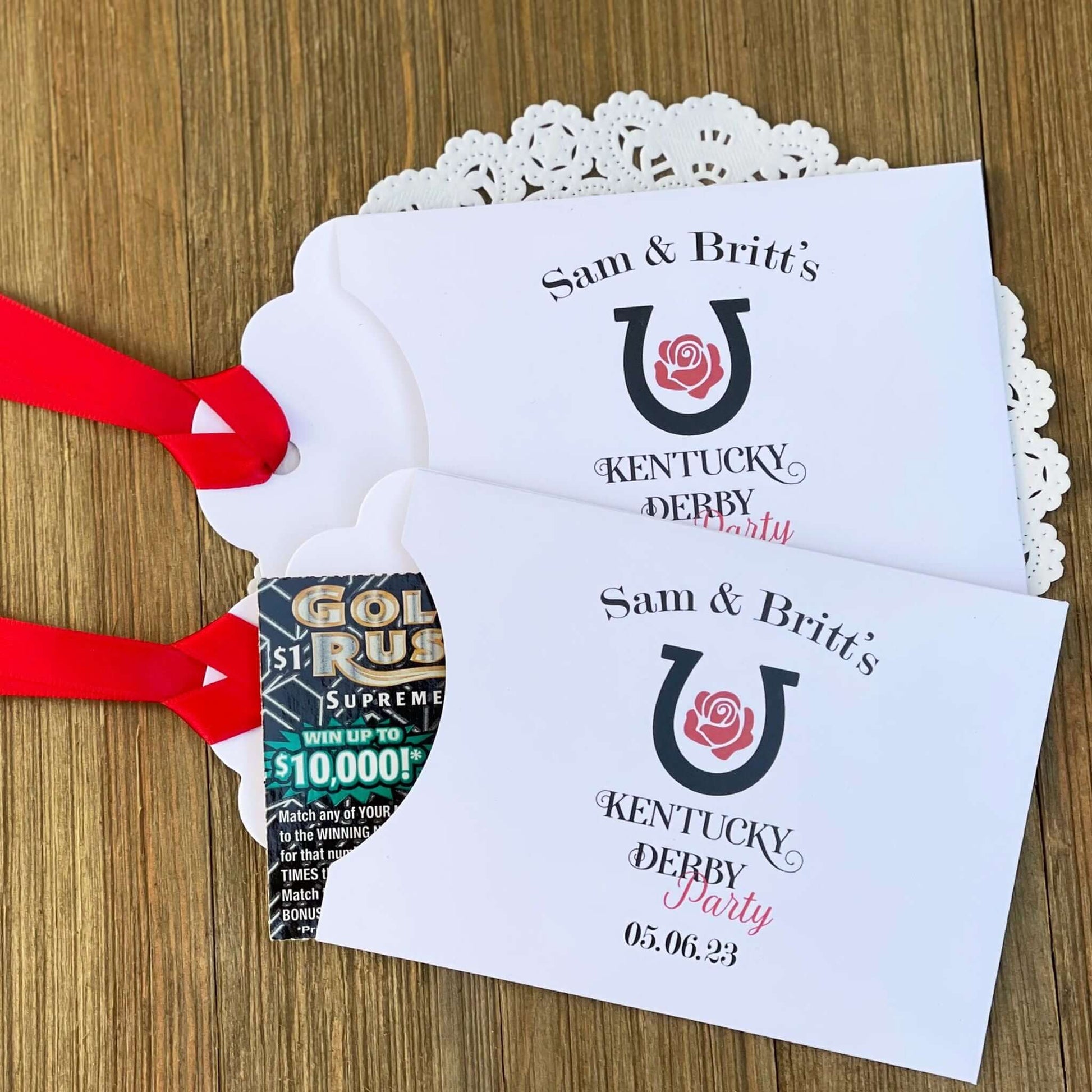 Personalized Kentucky Derby Party Favors , white envelopes adorned with Kentucky Derby Party red ribbon comes attached.  Slide a lottery ticket in and see who wins.