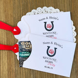 Kentucky Derby party favors, personalized for your event.  White envelopes adorned with Kentucky Derby Party red ribbon comes attached.  Slide a lottery ticket in and see who wins.