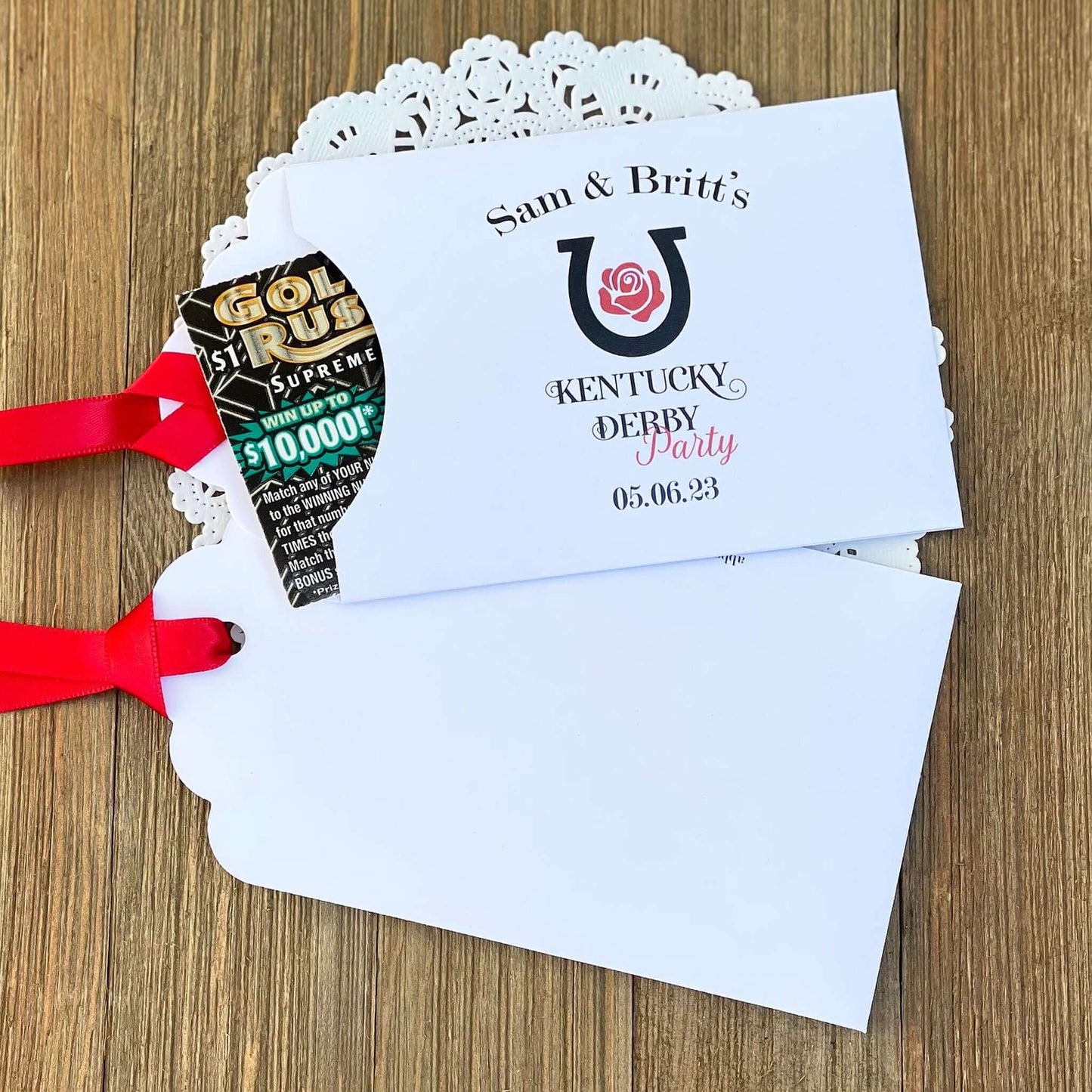 Personalized Kentucky Derby Party Favors , white envelopes adorned with Kentucky Derby Party red ribbon comes attached.  Slide a lottery ticket in and see who wins.