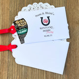 Kentucky Derby party favors, personalized for your event.  White envelopes adorned with Kentucky Derby Party red ribbon comes attached.  Slide a lottery ticket in and see who wins.