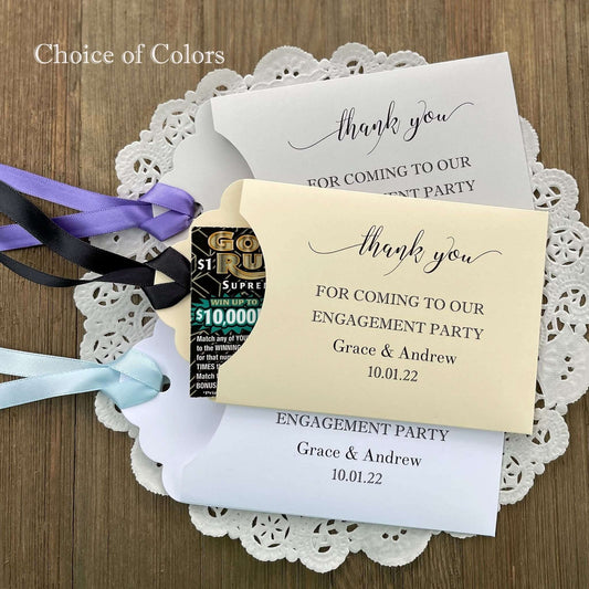 Personalized fun engagement party favors, envelopes for a lotto ticket  party favor.  Your choice of envelope color and ribbon color to match your party theme.  Celebrate your engagement in style with these unique engagement party favors.
