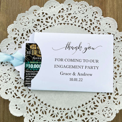 Personalized fun engagement party favors, envelopes for a lotto ticket  party favor.  Your choice of envelope color and ribbon color to match your party theme.  Celebrate your engagement in style with these unique engagement party favors.