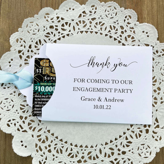 Personalized fun engagement party favors, envelopes for a lotto ticket  party favor.  Your choice of envelope color and ribbon color to match your party theme.  Celebrate your engagement in style with these unique engagement party favors.