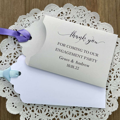 Personalized fun engagement party favors, envelopes for a lotto ticket  party favor.  Your choice of envelope color and ribbon color to match your party theme.  Celebrate your engagement in style with these unique engagement party favors.