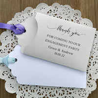 Personalized engagement party favors, envelopes for a lotto ticket  party favor.  Your choice of envelope color and ribbon color to match your party theme.  Celebrate your engagement in style with these unique engagement party favors.