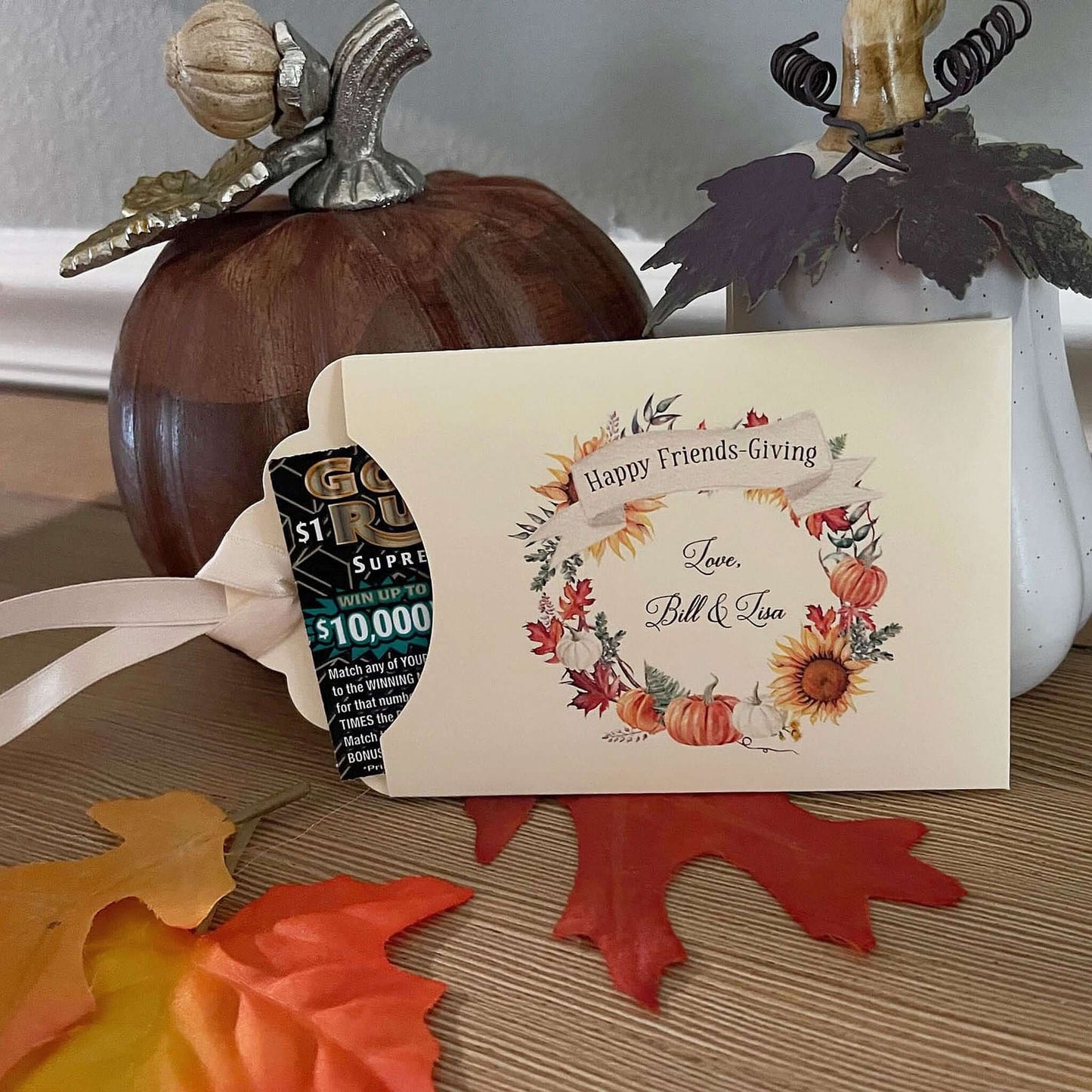 Personalized Friendsgiving Table Favors to add that special touch to your table.  Printed on ivory card stock with a fall wreath printed to bring the colors to your table.  Slide a lottery ticket in to see which guest wins, adding some fun to your Friendsgiving celebration.