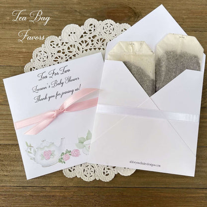 Tea Party Baby Shower Favors add your favorite tea bags to these envelopes for a sweet baby shower favor.  Tea for two, perfect for a twin baby shower.  Adonred with tea pot and cups in pink and white. 