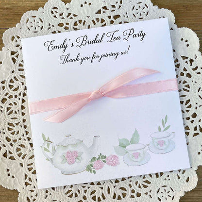Tea Party Bridal Shower Favors personalized for the bride to be.  Slide tea bags in the envelope for the perfect tea party table favor.  Adorned with teapot and teacups your choice of pink or white ribbon