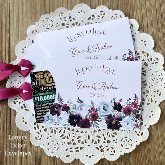 Burgundy Floral Wedding Guest Favors, personalized for the bride and groom.  Adorned with burgundy flowers and ribbon which comes attached, unique and fun wedding favors.