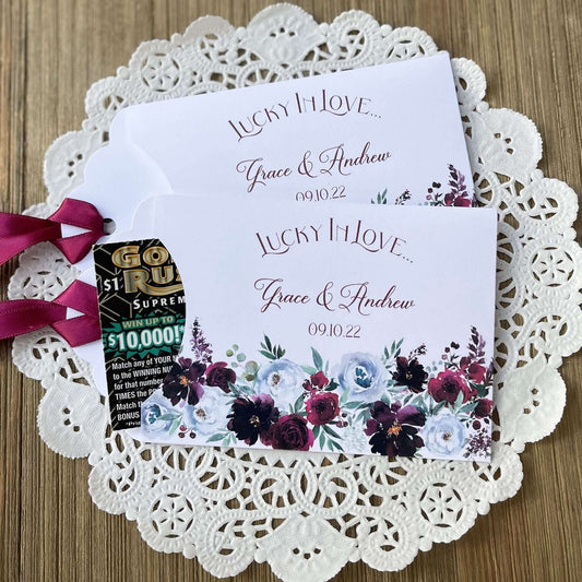 Burgundy Floral Wedding Guest Favors, personalized for the bride and groom.  Adorned with burgundy flowers and ribbon which comes attached, unique and fun wedding favors.