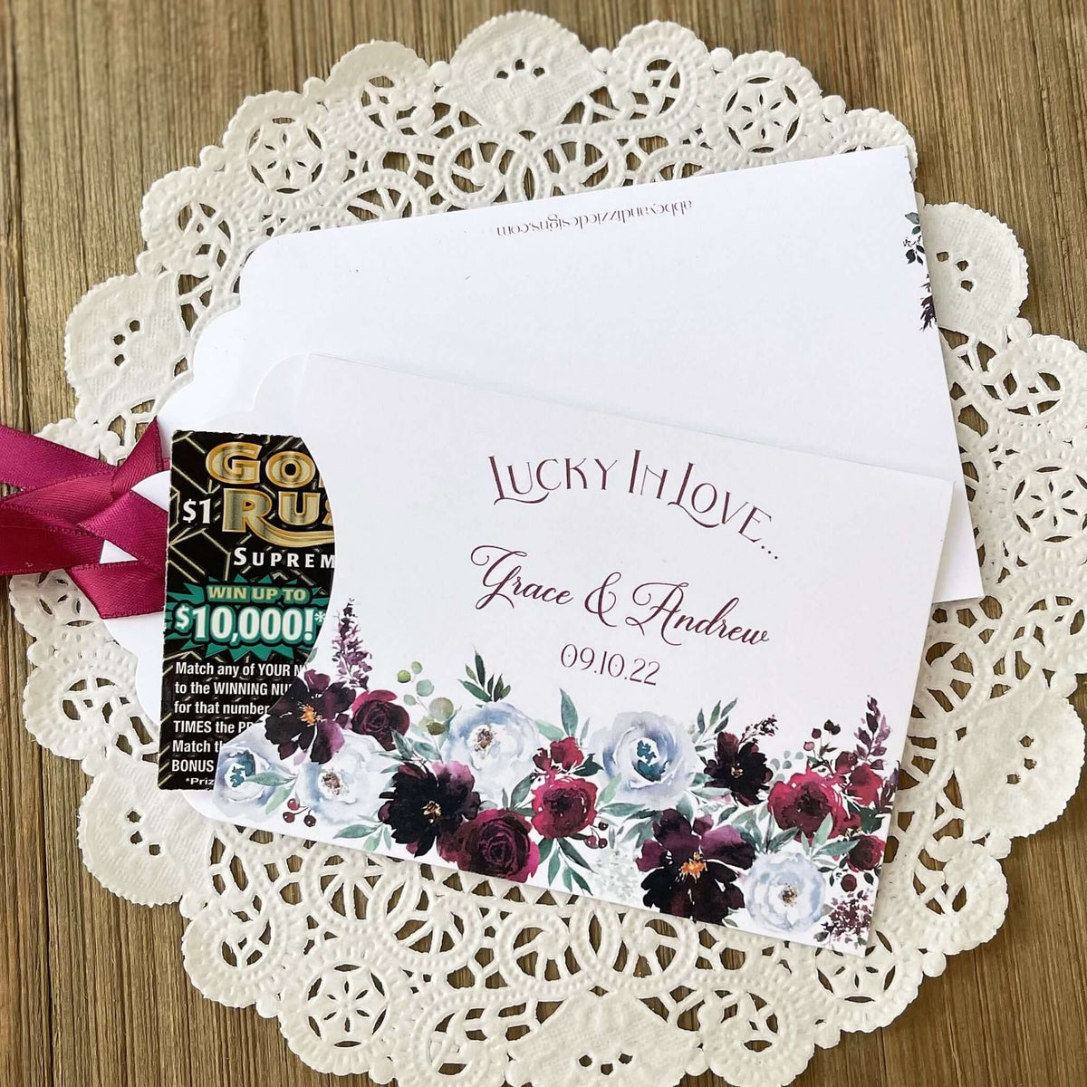 Burgundy Floral Wedding Guest Favors, personalized for the bride and groom.  Adorned with burgundy flowers and ribbon which comes attached, unique and fun wedding favors.