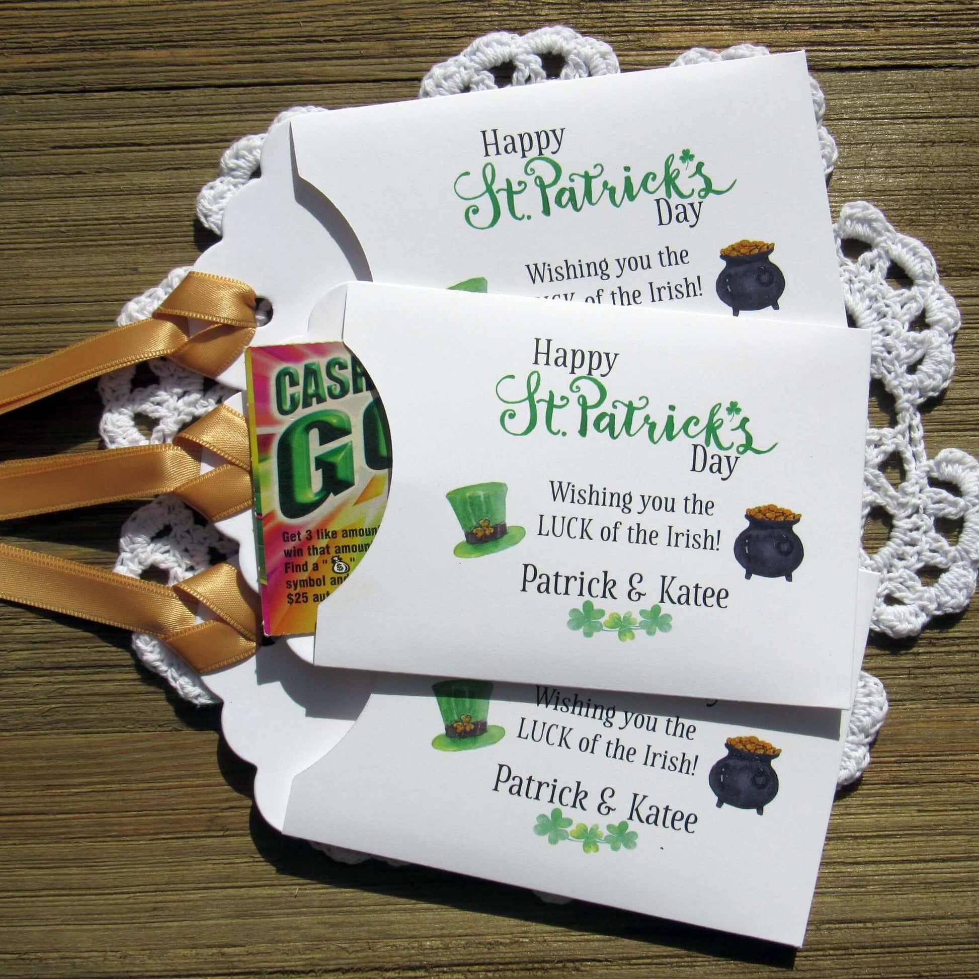 Personalized St Patrick's Day Party Favors, 'Happy St. Patrick's Day, wishing you the LUCK of the Irish'.  Printed on white card stock, adorned with a green hat, pot of gold and gold ribbon attached.  Slide a lottery ticket in the open end and see who has the LUCK of the Irish.