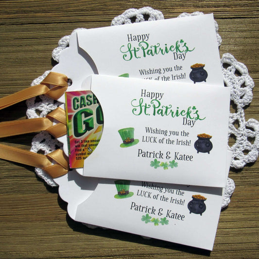 Personalized St Patrick's Day Party Favors, 'Happy St. Patrick's Day, wishing you the LUCK of the Irish'.  Printed on white card stock, adorned with a green hat, pot of gold and gold ribbon attached.  Slide a lottery ticket in the open end and see who has the LUCK of the Irish.