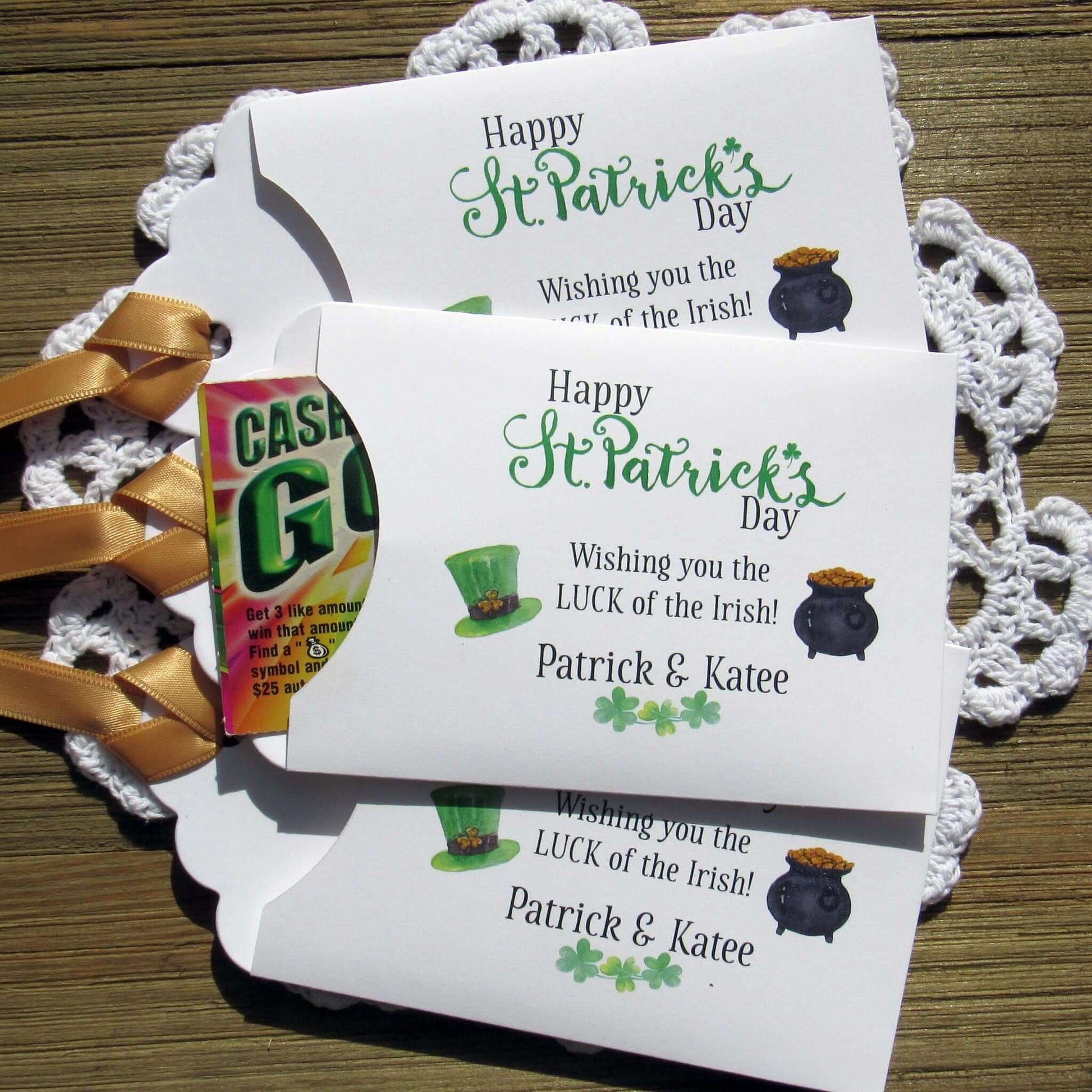 Personalized St Patrick's Day Party Favors, 'Happy St. Patrick's Day, wishing you the LUCK of the Irish'.  Printed on white card stock, adorned with a green hat, pot of gold and gold ribbon attached.  Slide a lottery ticket in the open end and see who has the LUCK of the Irish.