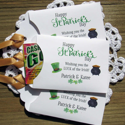 Personalized St Patrick's Day Party Favors, 'Happy St. Patrick's Day, wishing you the LUCK of the Irish'.  Printed on white card stock, adorned with a green hat, pot of gold and gold ribbon attached.  Slide a lottery ticket in the open end and see who has the LUCK of the Irish.