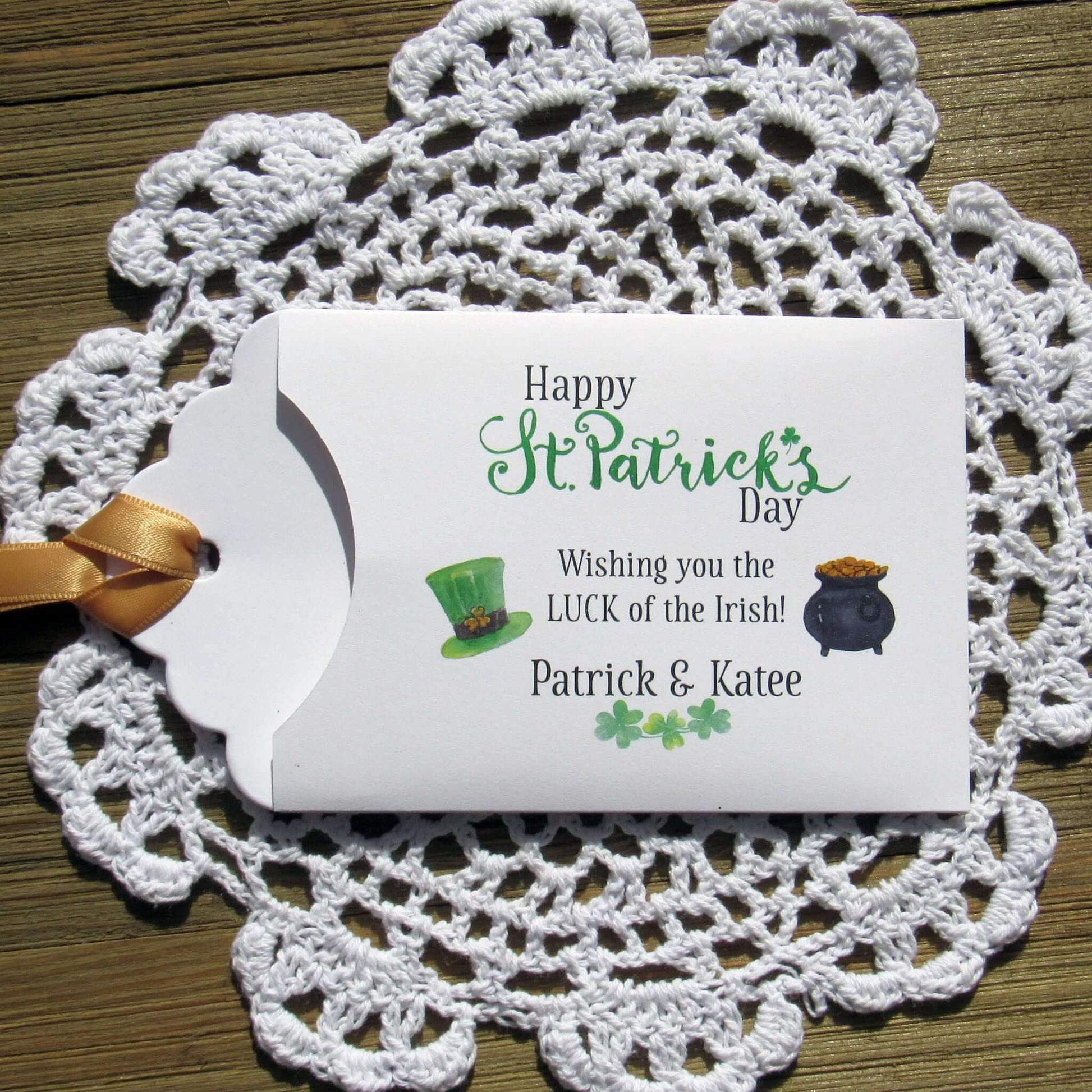 Personalized St Patrick's Day Party Favors, 'Happy St. Patrick's Day, wishing you the LUCK of the Irish'.  Printed on white card stock, adorned with a green hat, pot of gold and gold ribbon attached.  Slide a lottery ticket in the open end and see who has the LUCK of the Irish.