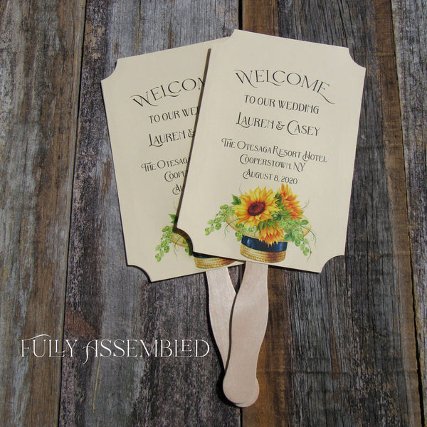 Sunflower Wedding Fans are personalized for the bride and groom including place and date.  Printed on ivory card stock fans are two sided with handle hidden between, they ship to you fully assembled.