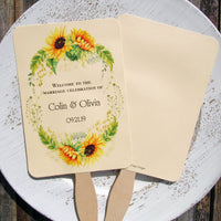 Sunflower wedding fans , personalized for the bride and groom and adorned with a ring of sunflowers.  Fans are printed on ivory cardstock, two sided so handle is hidden between.  Wedding fans ship fully assembled and ready for your big day.