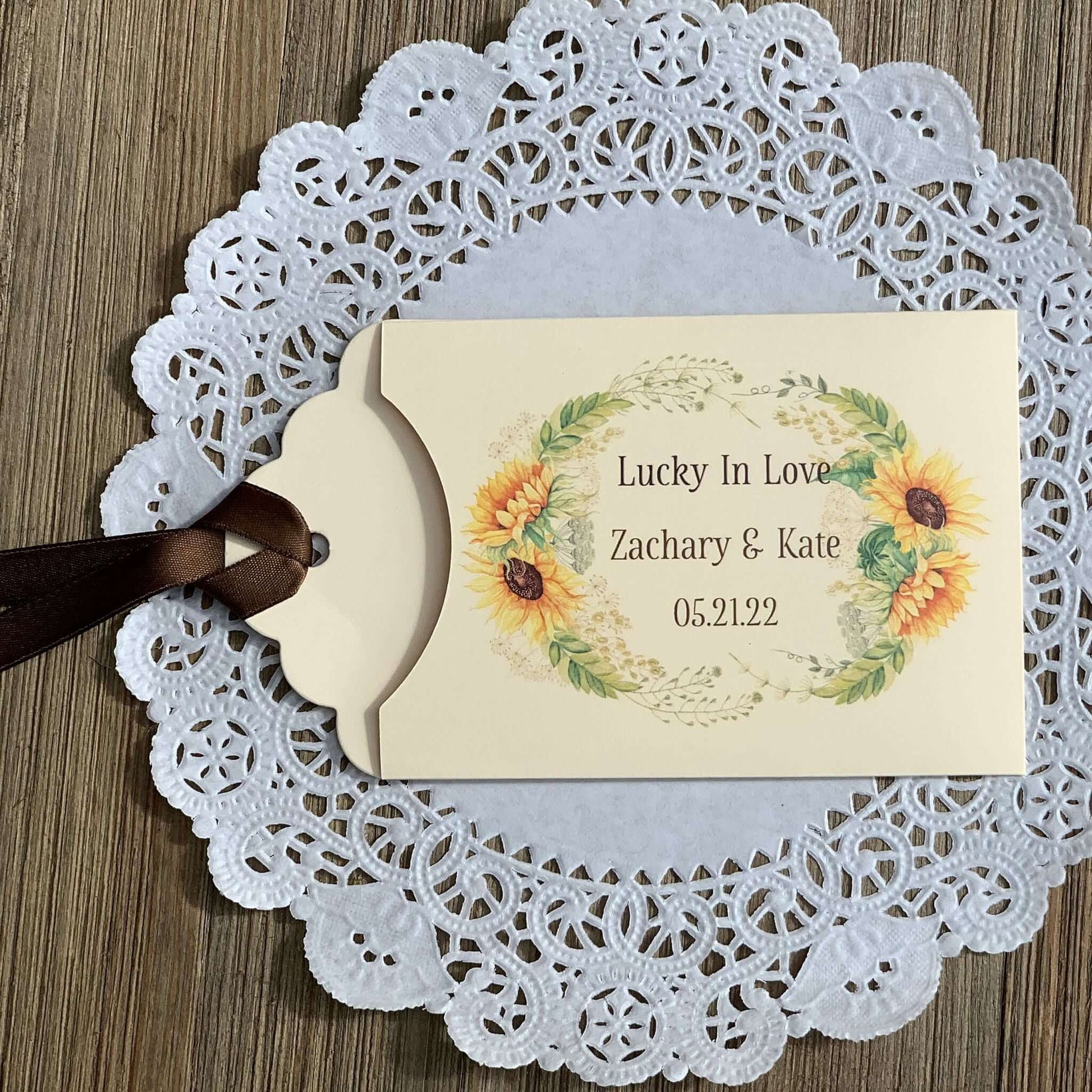 Sunflower Wedding Favors Lotto Ticket Holders, personalized for the bride and groom.  Envelopes are ivory with your choice of ribbon color, adorned with a beautiful sunflower frame.  
