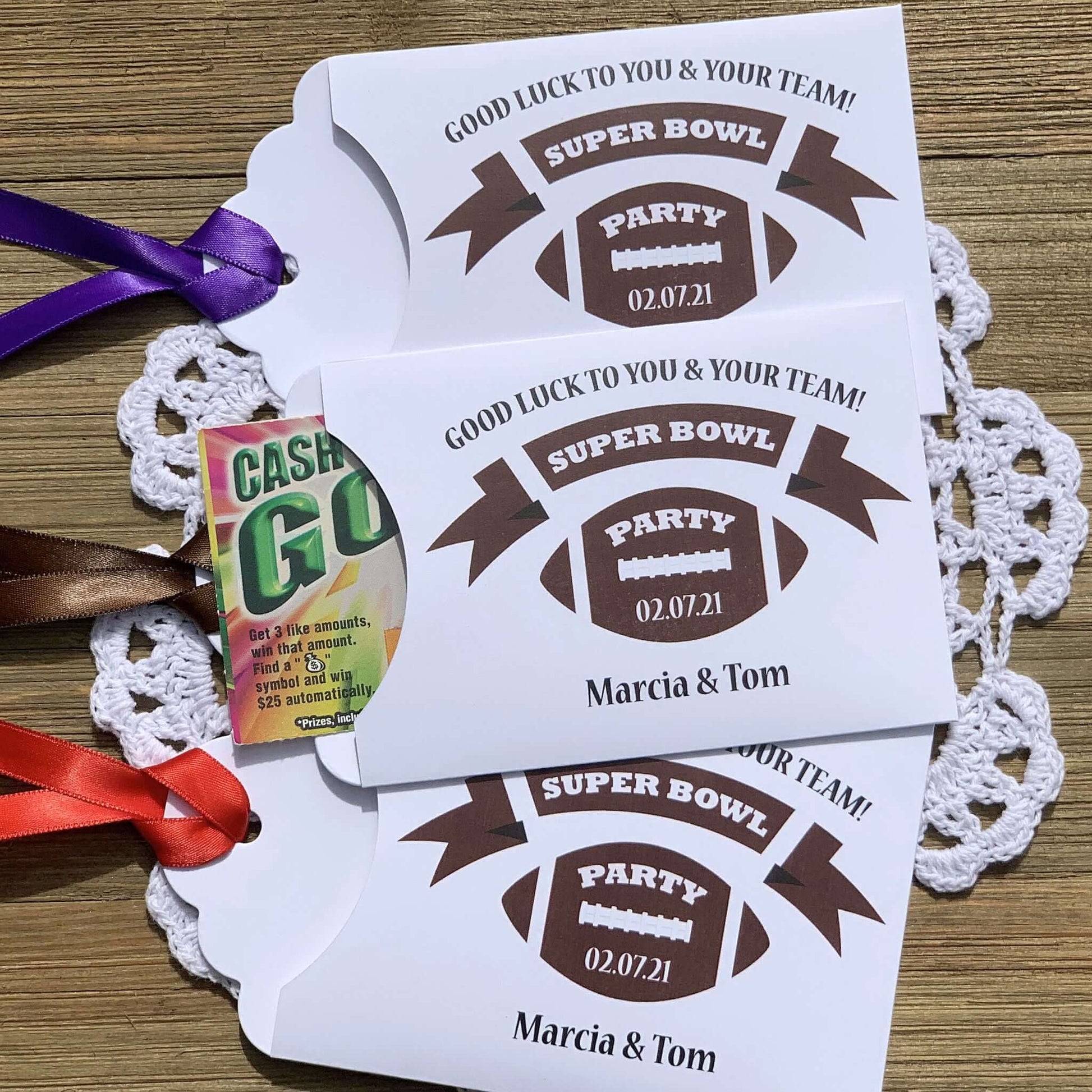 Super Bowl Party Favors - Football Party Favors, printed on white card stock with your choice of ribbon color.  Personalized for you, adorned with a football and the party date.  Slide a scratch off lottery ticket in the open end, a fun party favor.