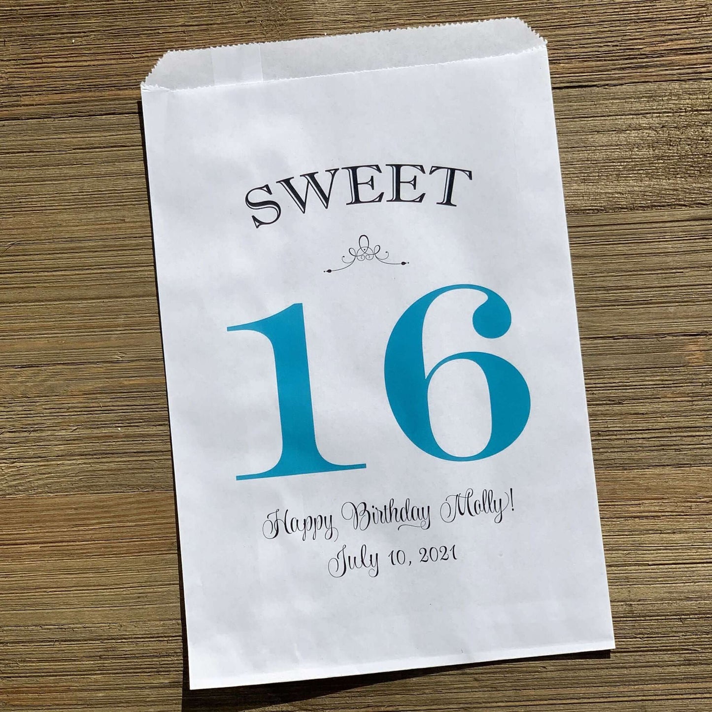 Personalized Sweet 16 Favor Bags for the guest of honor.  White bags printed with sweet 16 in large print with color options.  Can be used for candy bags, cookie bags or treat bags.  