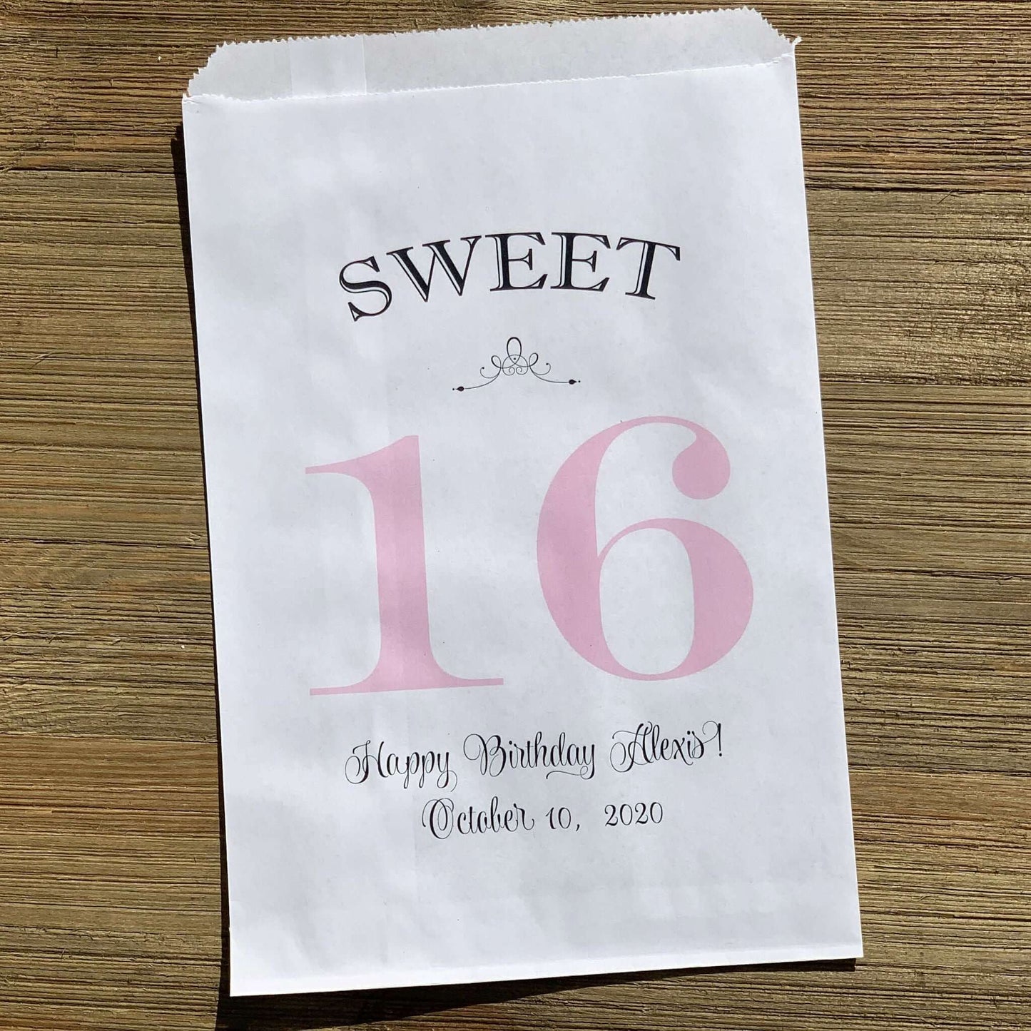 Personalized Sweet 16 Favor Bags for the guest of honor.  White bags printed with sweet 16 in large print with color options.  Can be used for candy bags, cookie bags or treat bags.  