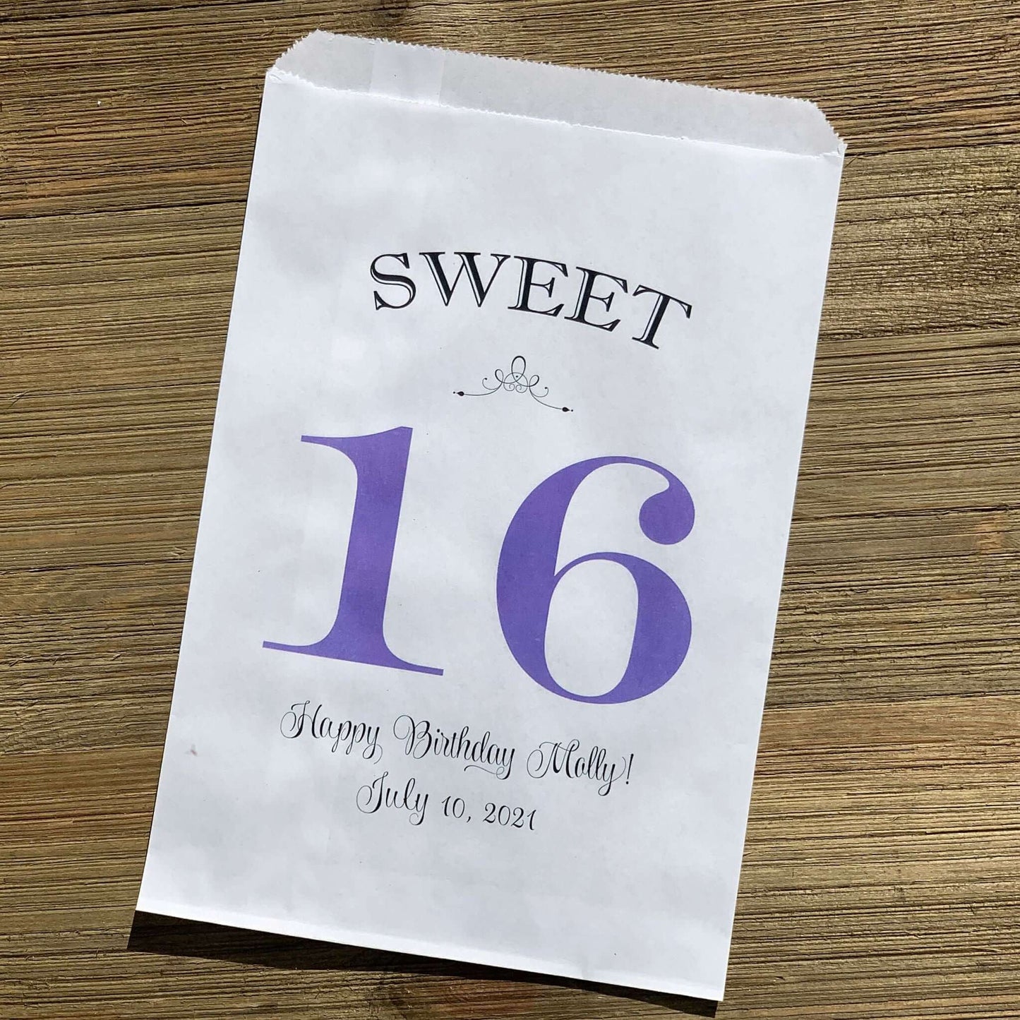 Personalized Sweet 16 Favor Bags for the guest of honor.  White bags printed with sweet 16 in large print with color options.  Can be used for candy bags, cookie bags or treat bags.  