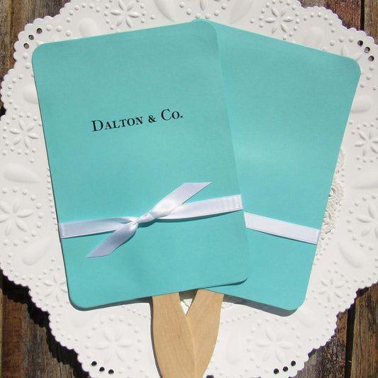 An elegant take on the hand fan , these Aqua Wedding Fans with Ribbon are sure to be appreciated on that hot sunny day.  Personalized with couples last name & Co.  White ribbon is included and comes attached.